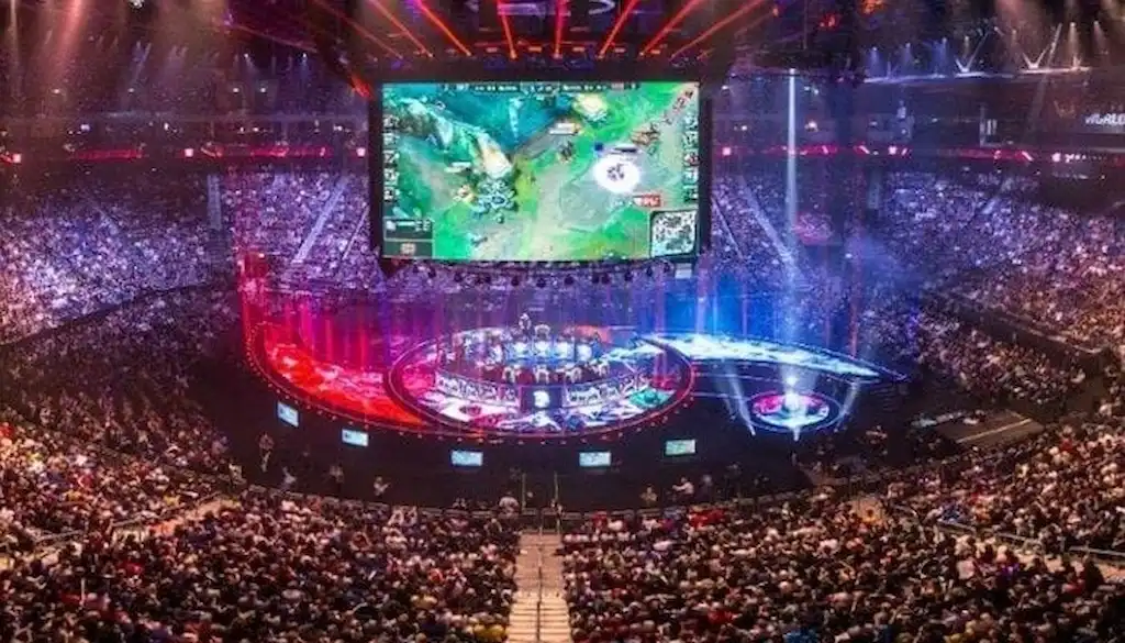 A massive crowd fills a packed arena during the League of Legends World Championship.