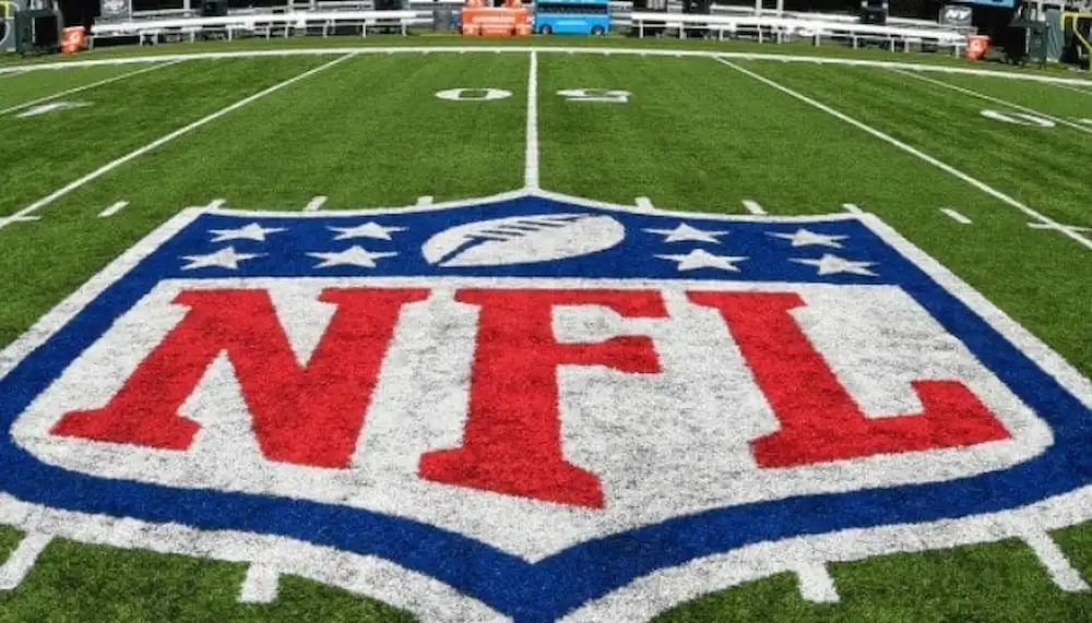 The NFL logo is prominently displayed at the center of the football field.