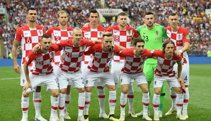 Croatia national soccer team poses for a group photo on the field before a World Cup match.