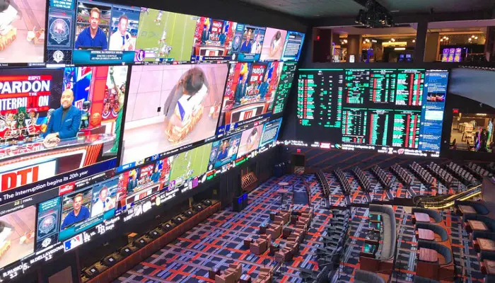betting house showing screens with bets and sports