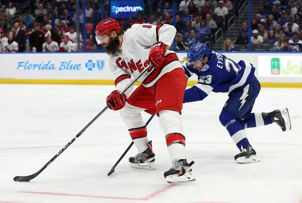 A Carolina Hurricanes player controls the puck.