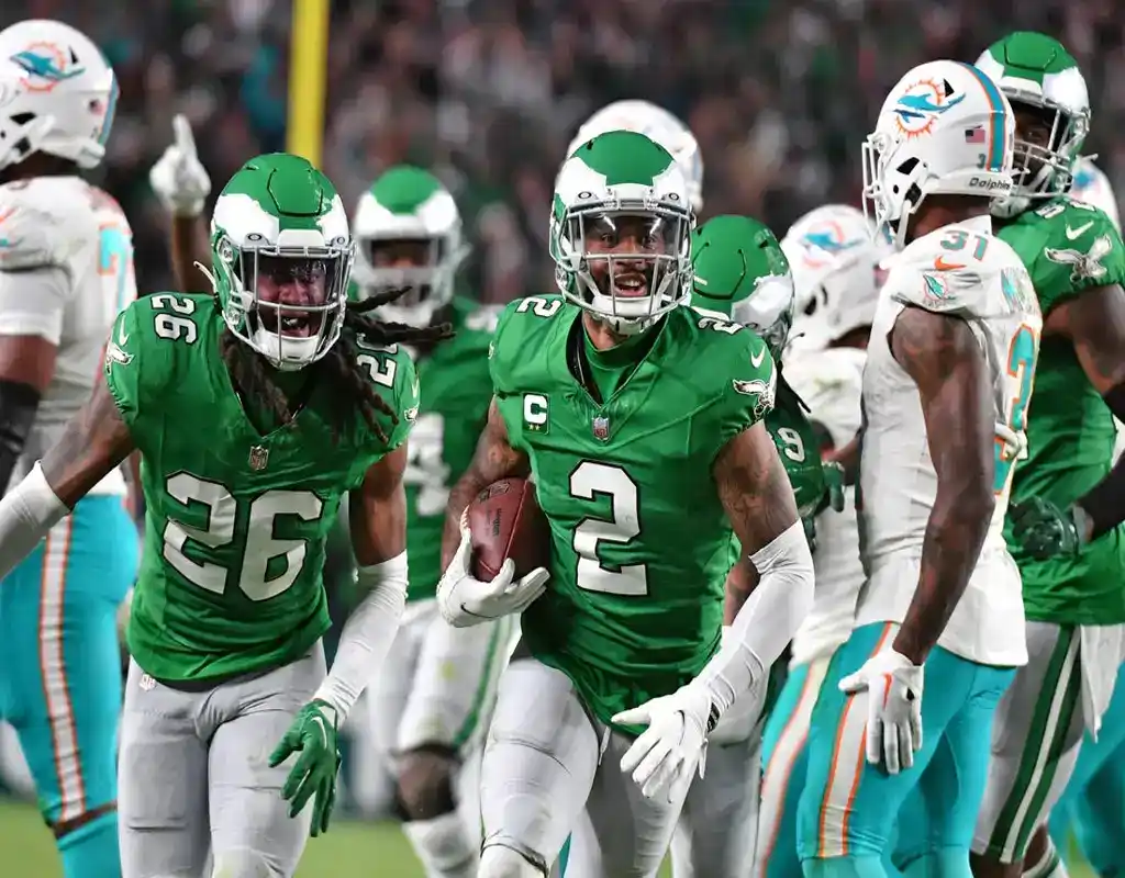 Philadelphia Eagles defenders celebrate a turnover against the Miami Dolphins during an NFL game