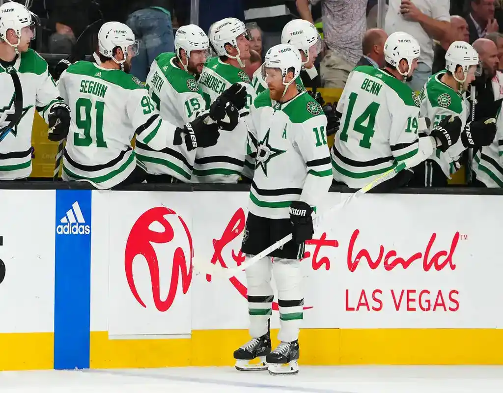 NHL 10 Dallas Stars players celebrate on the bench after a goal against the Pittsburgh Penguins