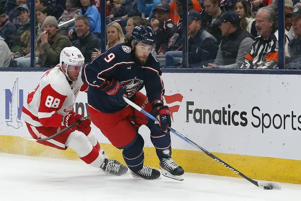 NHL 6 columbus blue jackets player with calgary flames player behind