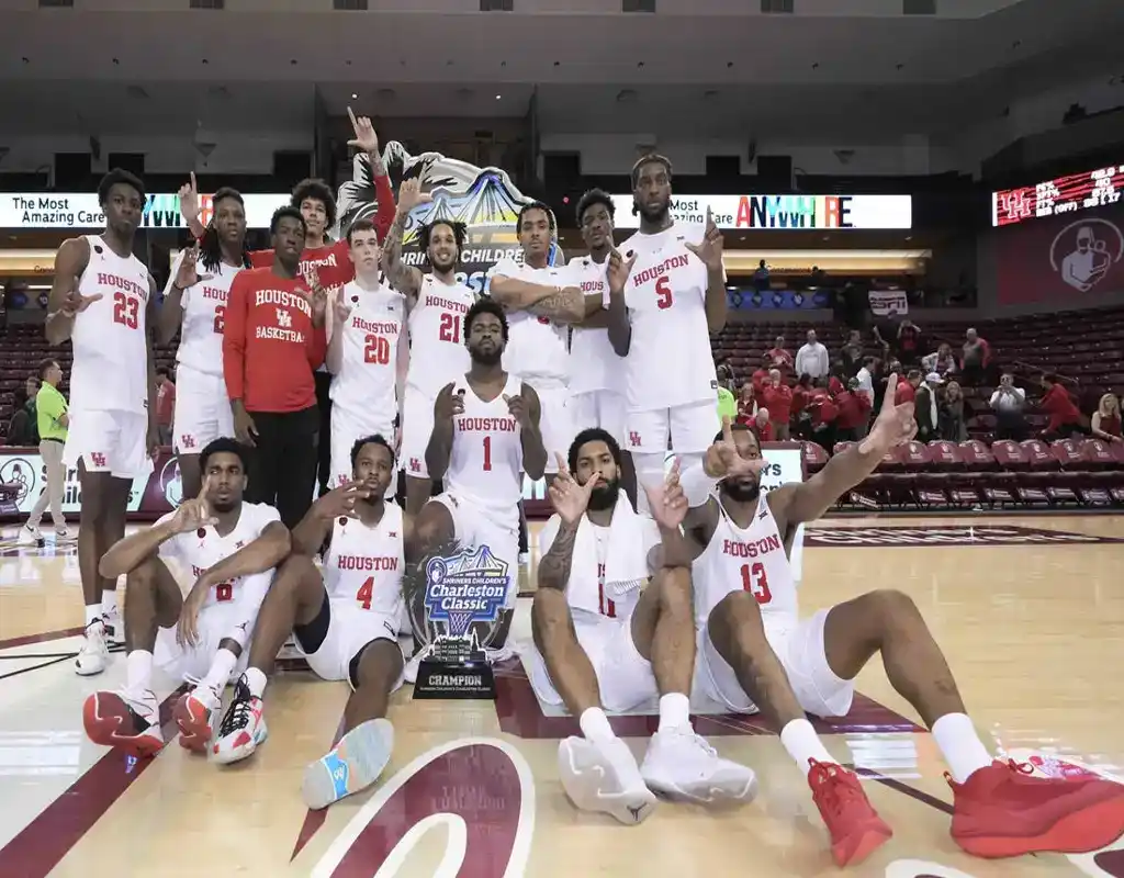 Houston Cougars basketball team celebrates with trophy after Charleston Classic championship win