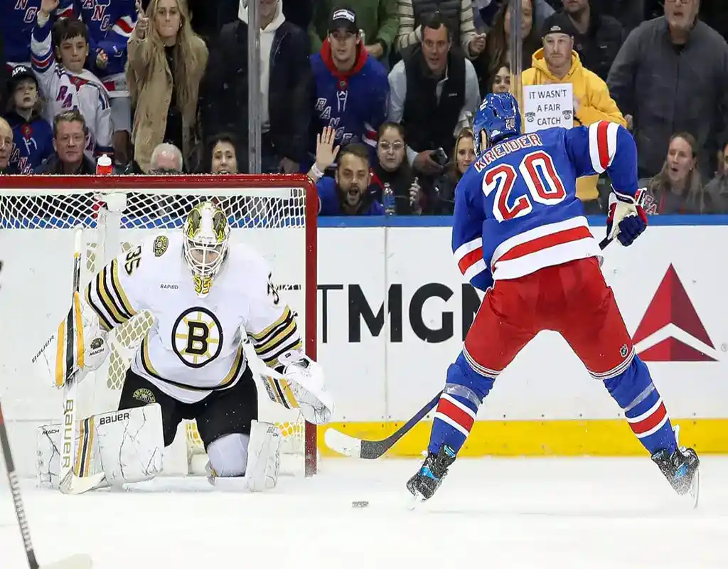 New York Rangers forward approaches Boston Bruins goalie during NHL breakaway chance