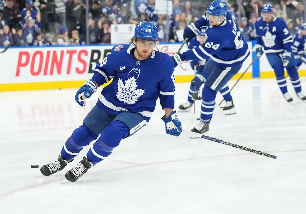 Toronto Maple Leafs players skate during warmups.