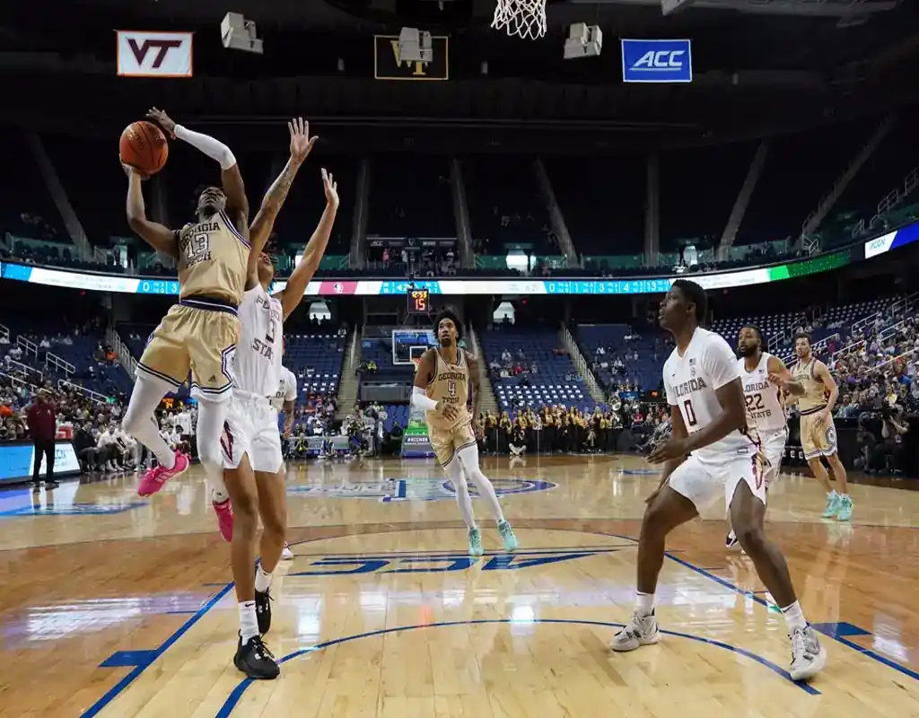 Georgia Tech Yellow Jackets player goes up for a layup against the UMass Lowell River Hawks during their November 14, 2023, matchup.