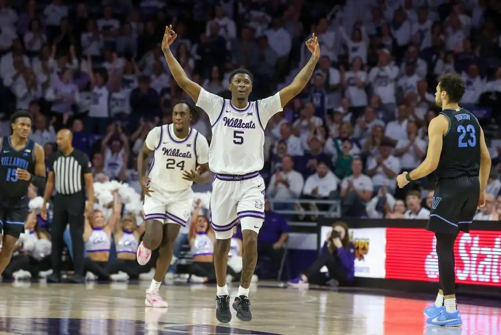 NCAAB 2 Kansas State Wildcats basketball players celebrate during a game against the Villanova Wildcats