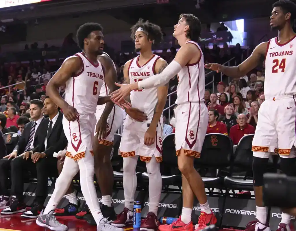 USC Trojans players celebrate at the bench during their game against the Auburn Tigers on December 17, 2023