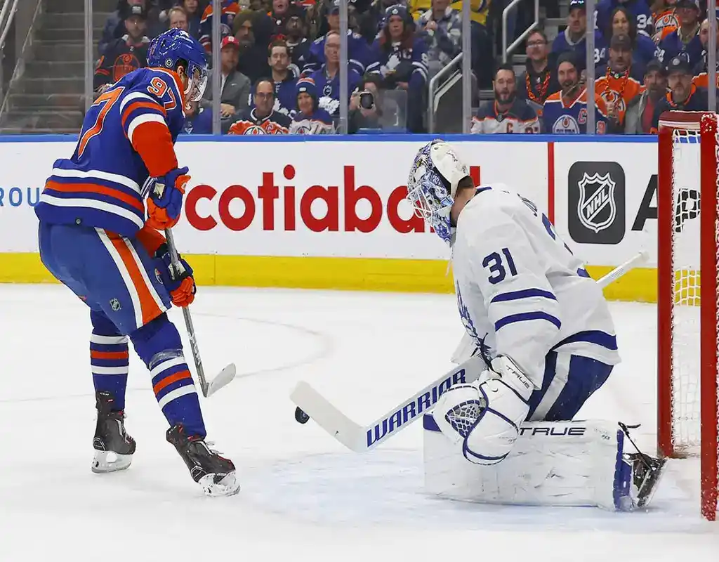NHL 10 Edmonton Oilers forward attempts to score against Toronto Maple Leafs goalie during NHL game