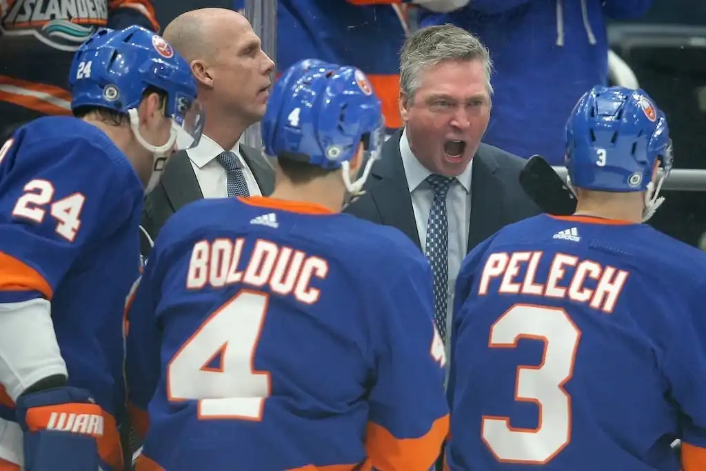 NHL 6 New York Islanders head coach passionately addresses players during a game.