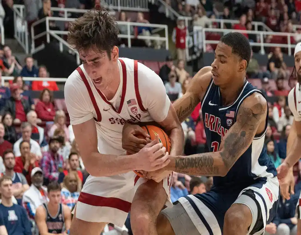 Arizona Wildcats and Stanford Cardinal players battle for possession during college basketball game
