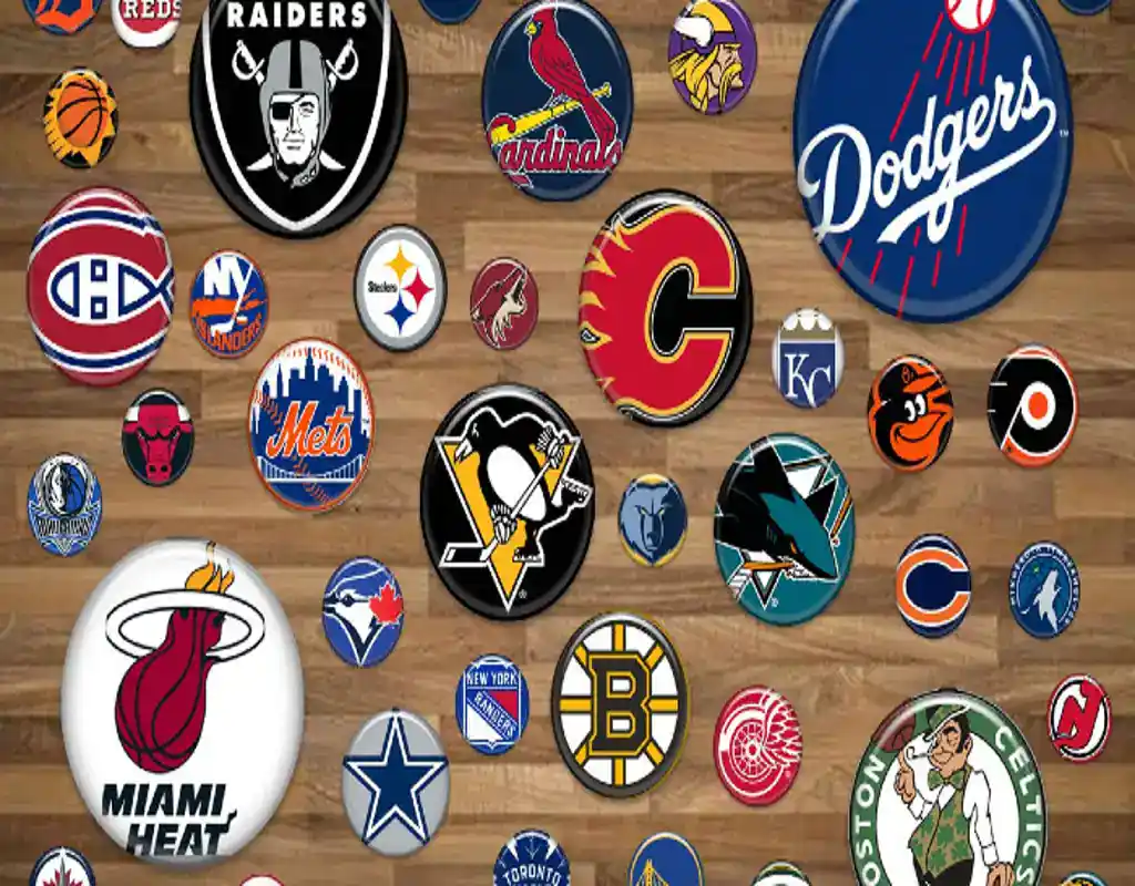 Collage of sports team logos from different American leagues on a wooden background.