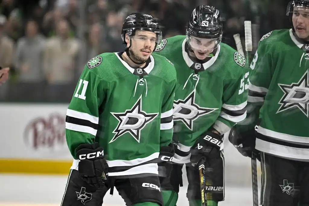 Dallas Stars players skate together during a game.