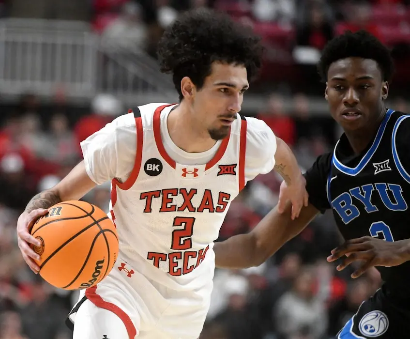 texas tech player holding the ball
