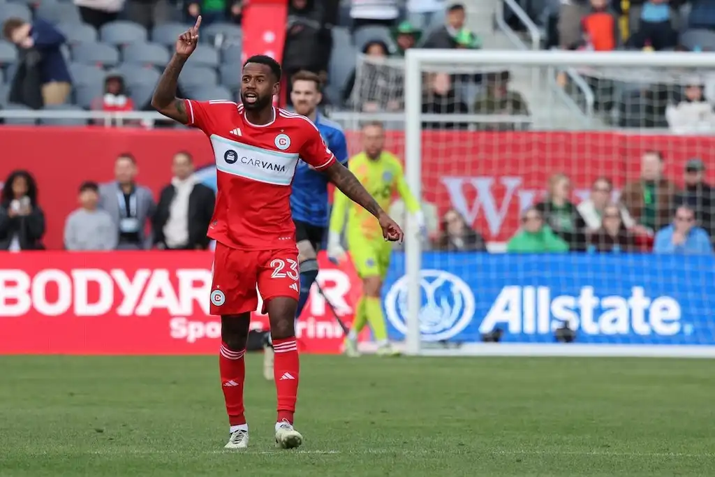 Previews 9 A Chicago Fire FC player raises his hand during a match.