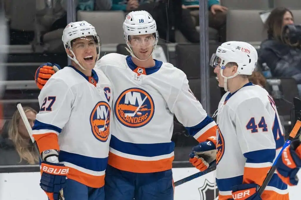New York Islanders players appear to be celebrating, possibly after a goal.