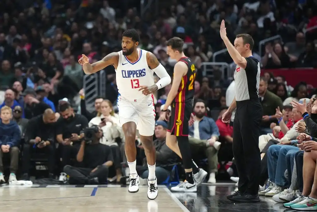 5 Los Angeles Clippers player Paul George reacts after a play near the sideline.