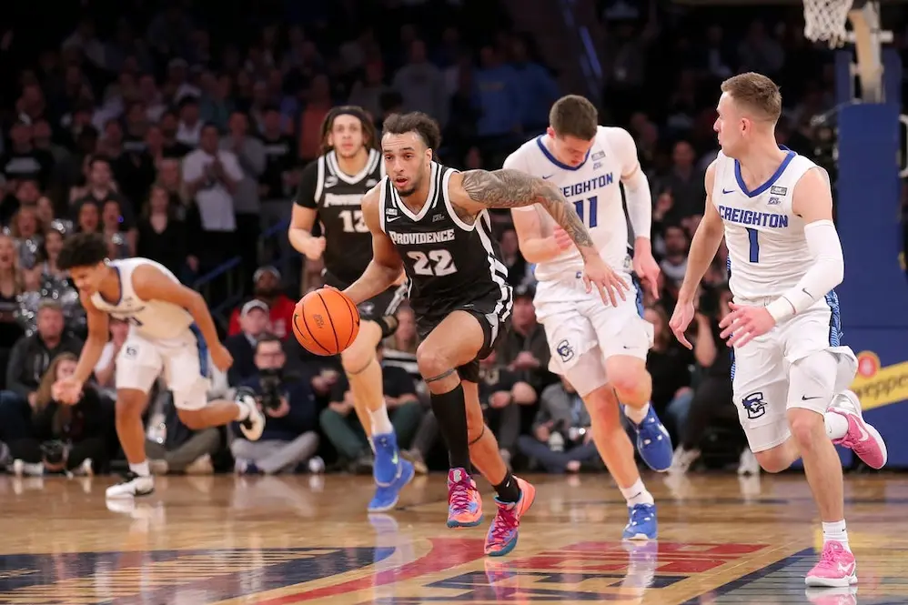 ncaab providence player running from creighton players