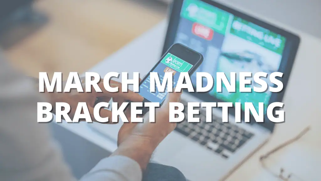 Person holding a smartphone with a sports betting app open, sitting in front of a laptop, with text reading "March Madness Bracket Betting."
