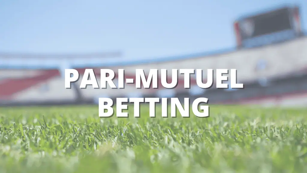 Close-up of grass on a sports field with blurred stadium in background and text reading "Pari-Mutuel Betting.