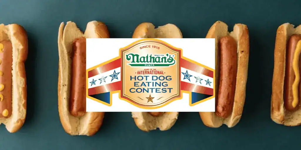 Nathan's Hot Dog Eating Contest logo overlaying several hot dogs on a teal background, celebrating the famous competitive eating event.