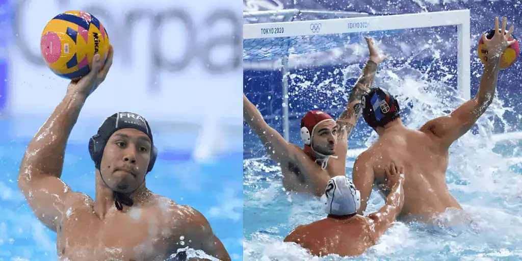 Two water polo players compete in a dynamic match, splashing water as one prepares to shoot while defenders attempt a block.