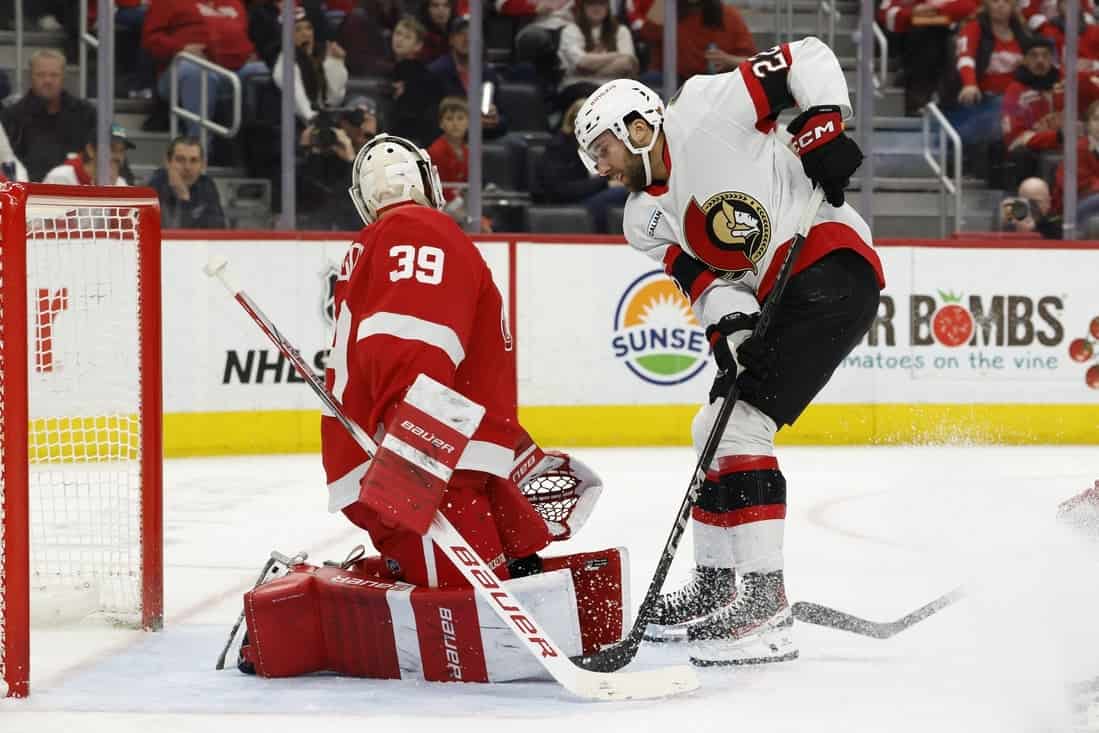 Otawa player shooting the puck