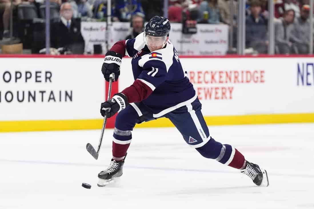 Colorado Avalanche Playe dribbling the puck