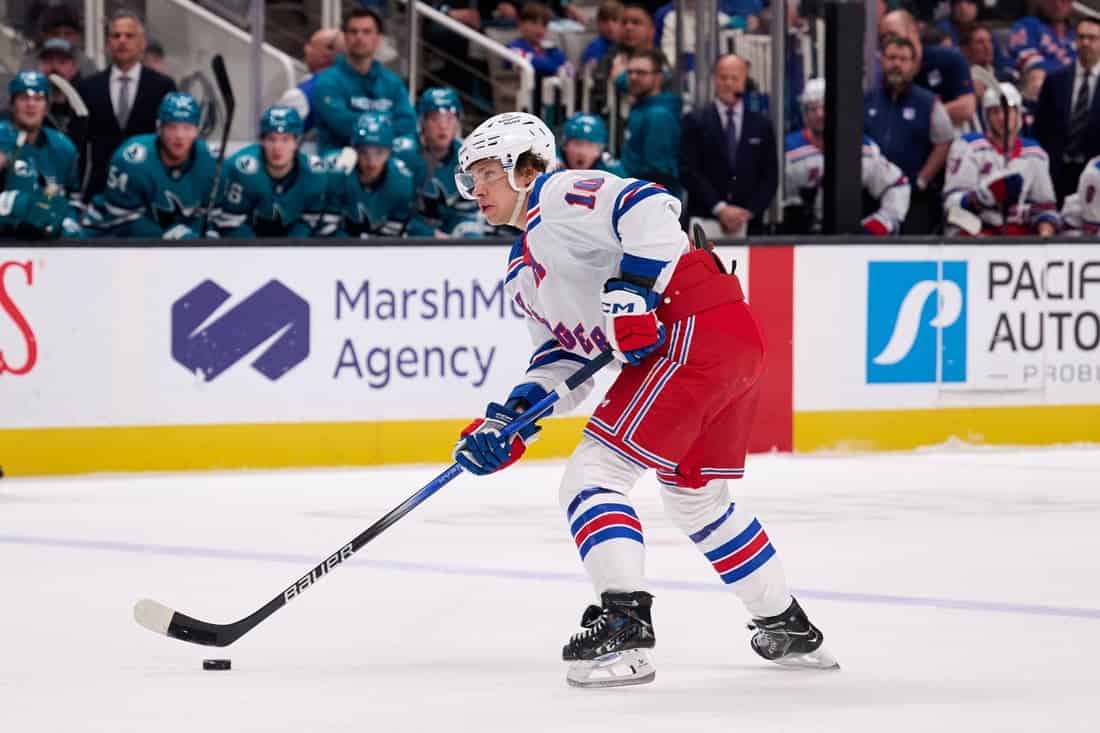 Rangers player Dribbling the puck alone