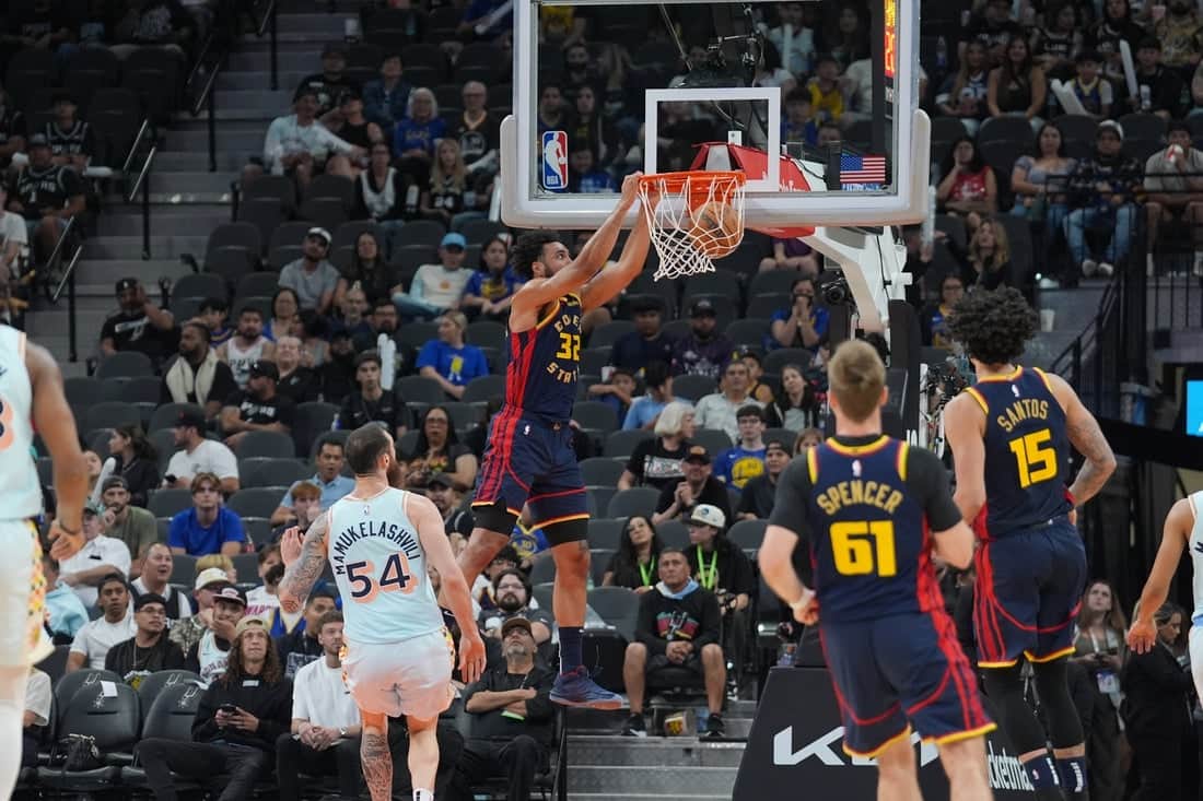 3 Warriors player making a dunk