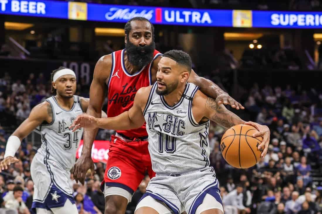 4 Magic Player Dribbling past James Harden