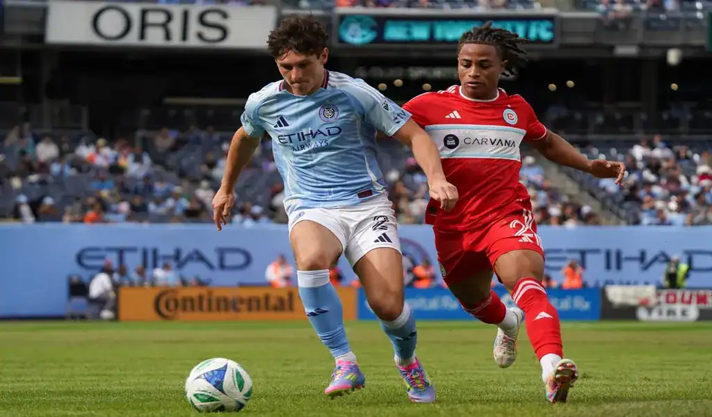 New York City FC player races for ball against Houston Dynamo defender