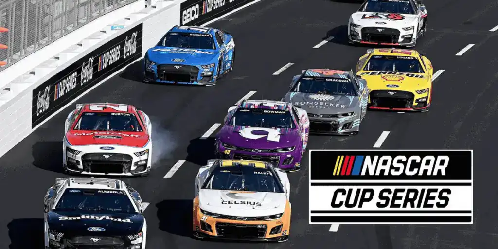 NASCAR Cup Series race featuring multiple colorful cars competing on a track, with the NASCAR logo prominently displayed below.