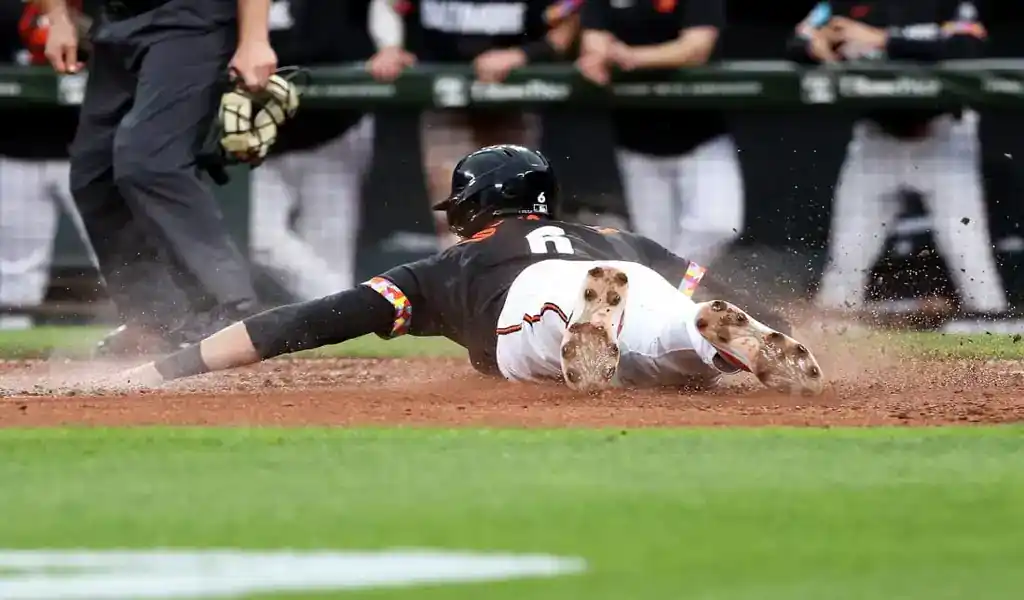 9 Baltimore Orioles player slides into home plate during matchup with Chicago White Sox on May 31, 2025