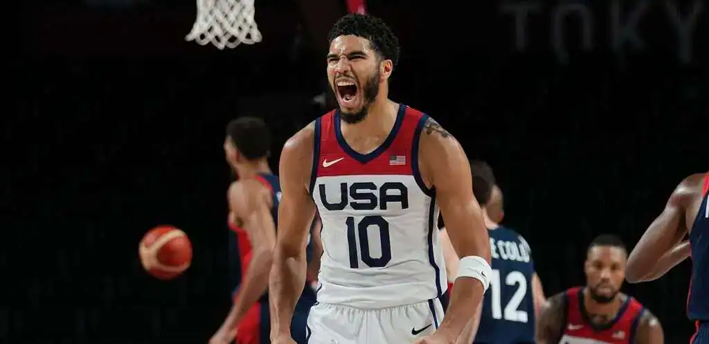Team USA basketball player celebrates during Olympic game