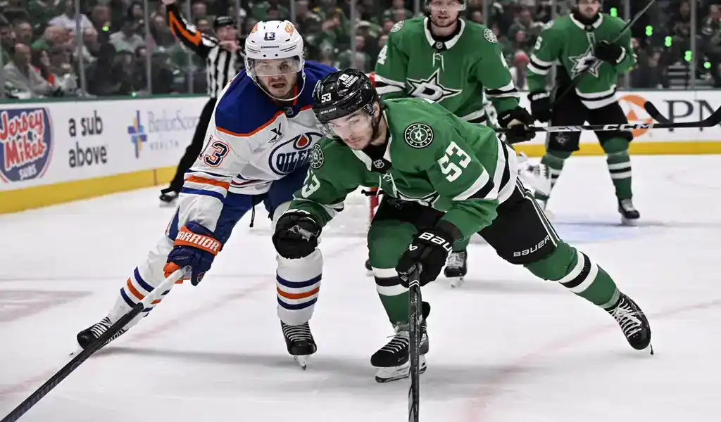 Dallas Stars and Edmonton Oilers players battle for puck during game on May 23, 2025.