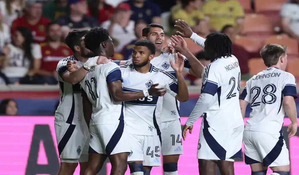 Vancouver Whitecaps players celebrate a goal against Minnesota United