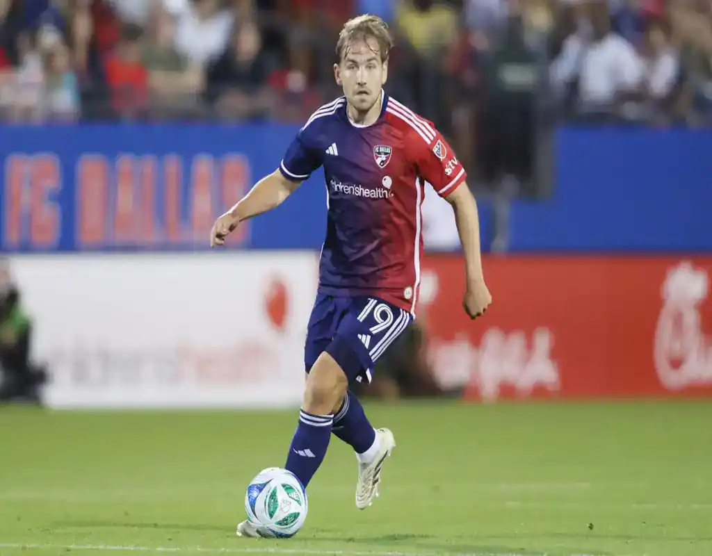 FC Dallas player dribbles the ball during a match against Houston Dynamo FC on May 17, 2025