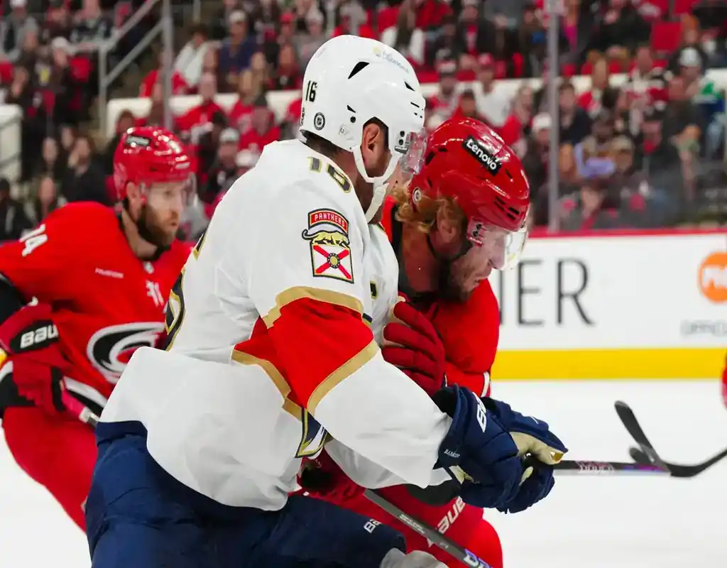 Florida Panthers and Carolina Hurricanes players battle for the puck during their May 20, 2025 game