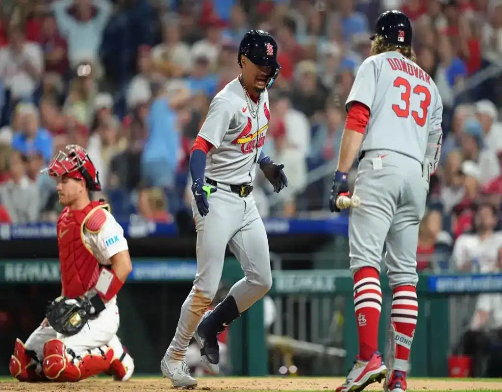 St. Louis Cardinals players celebrate at home plate during May 13, 2025 MLB game against the Philadelphia Phillies