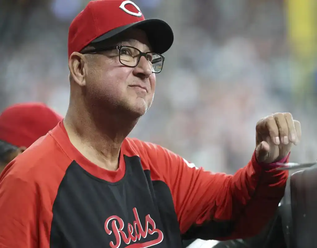 Cincinnati Reds coach watches from dugout during May 13, 2025 MLB matchup against Chicago White Sox