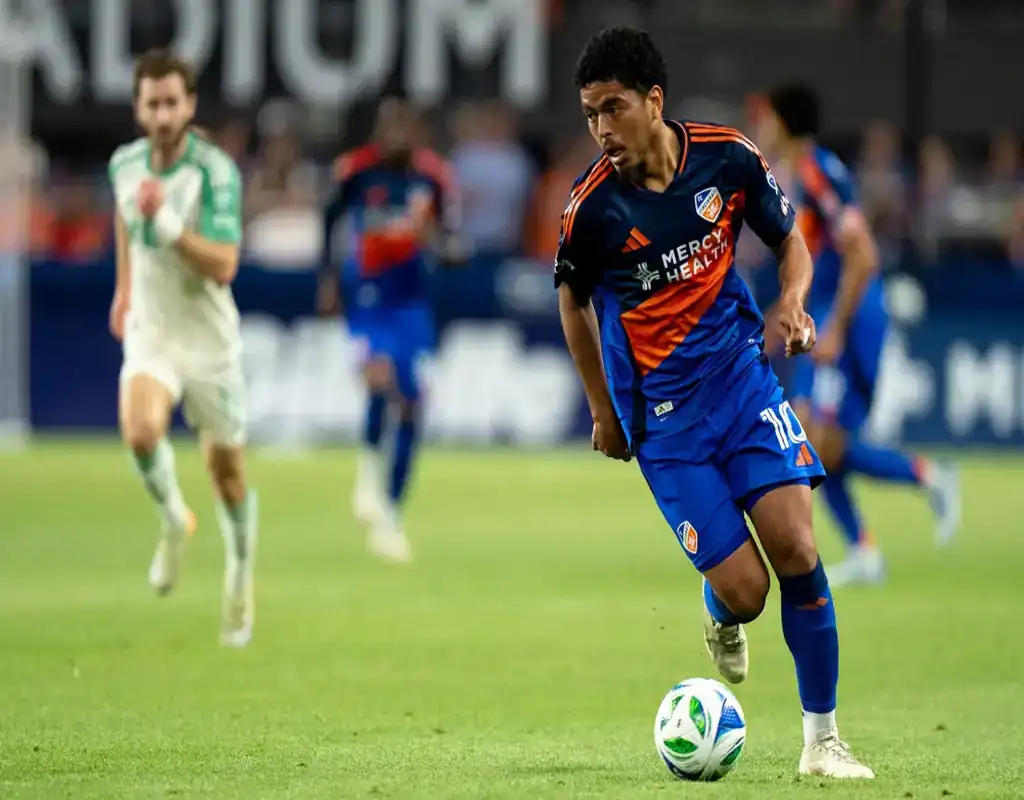 FC Cincinnati player dribbles past Toronto FC defender during May 14, 2025 MLS match