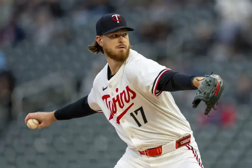 2 A pitcher from the Minnesota Twins in a white jersey with red lettering and the number 17, poised to throw a baseball.