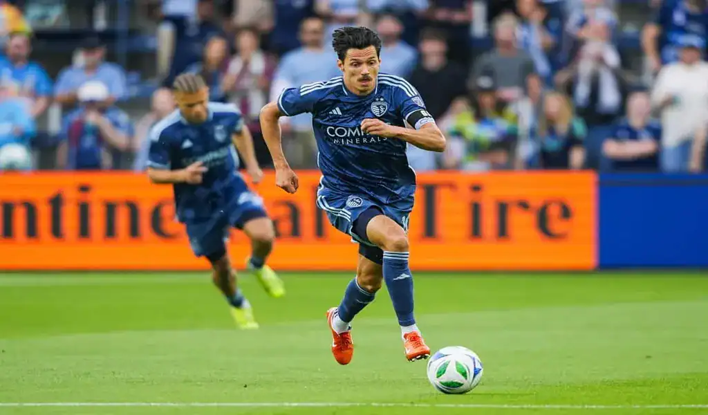 Sporting Kansas City player sprints with the ball during match against FC Dallas, June 14th 2025