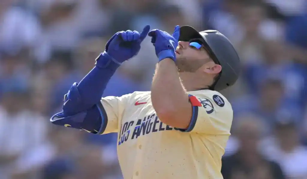 Los Angeles Dodgers player celebrates after scoring during matchup with New York Mets on June 4, 2025